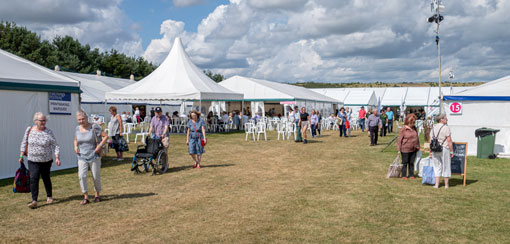 Festival marquees and visitors at Patchings Art Fest