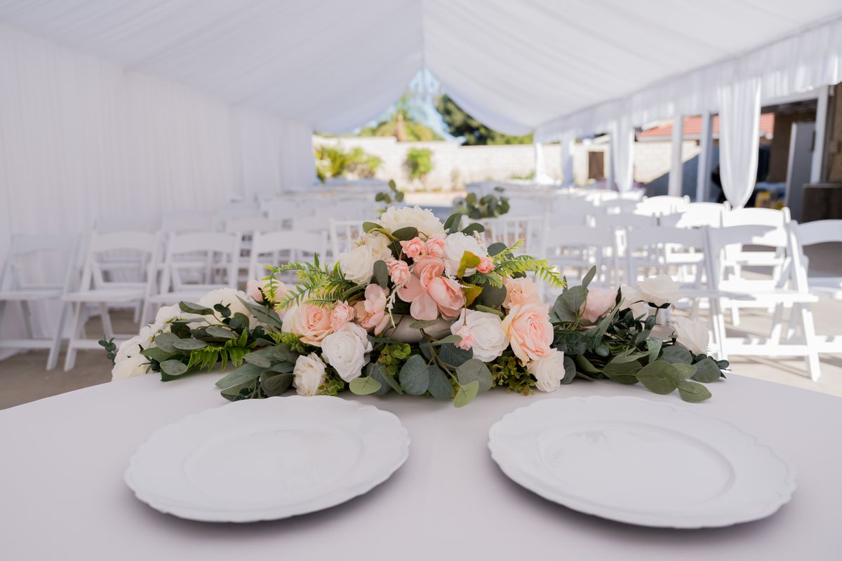 An elegantly dressed marquee, set for a private event